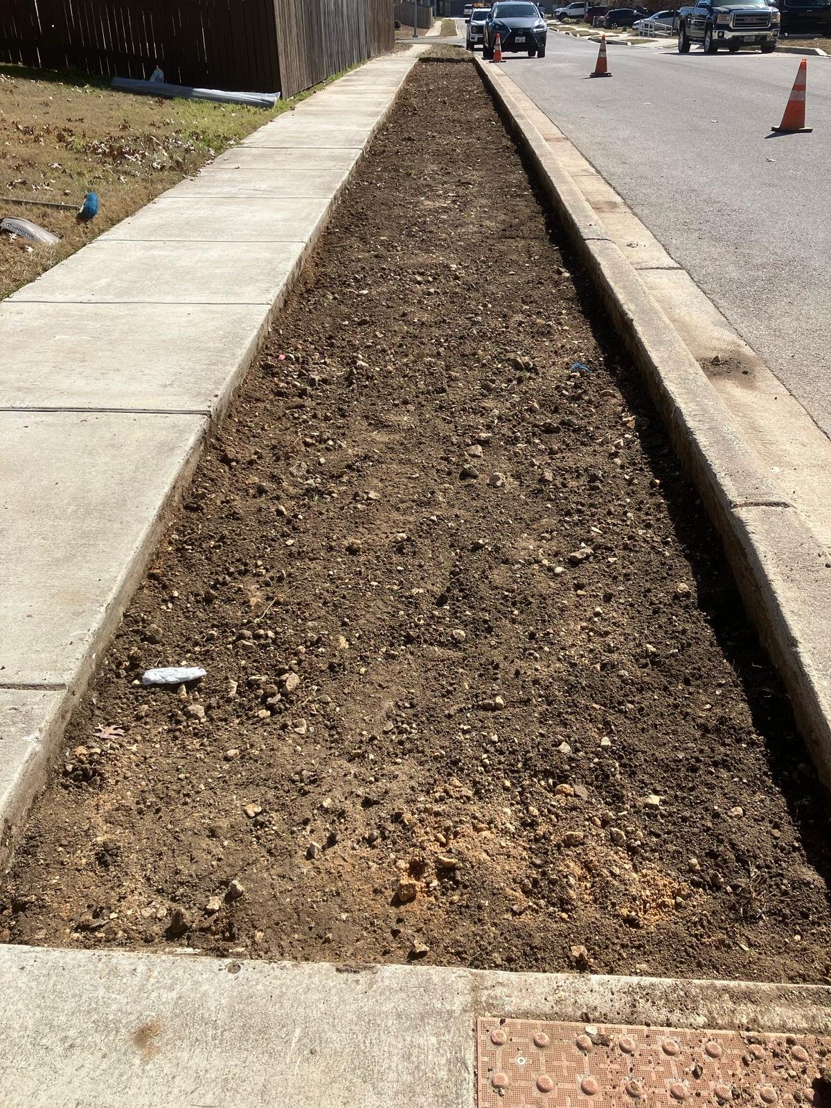 Xeriscaping prepped — graded soil ready for stone and plants
