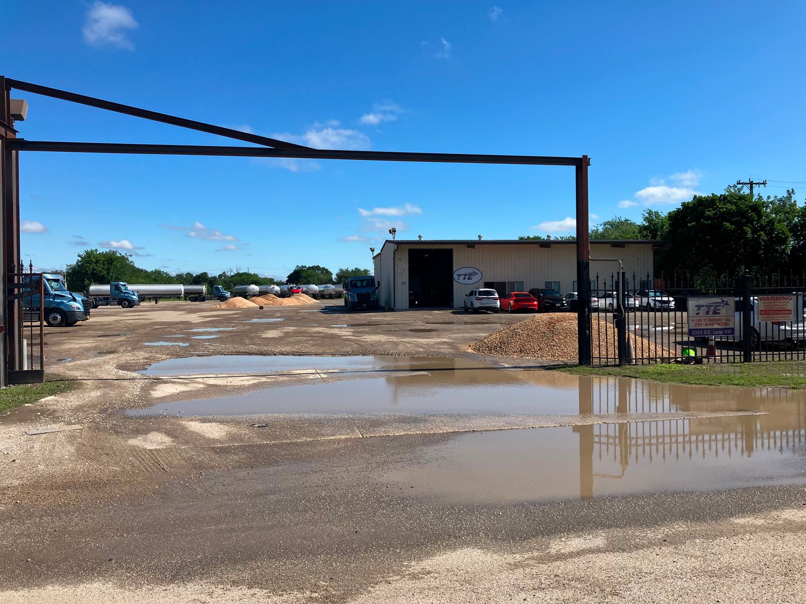 Commercial truck yard before parking lot improvements with standing water