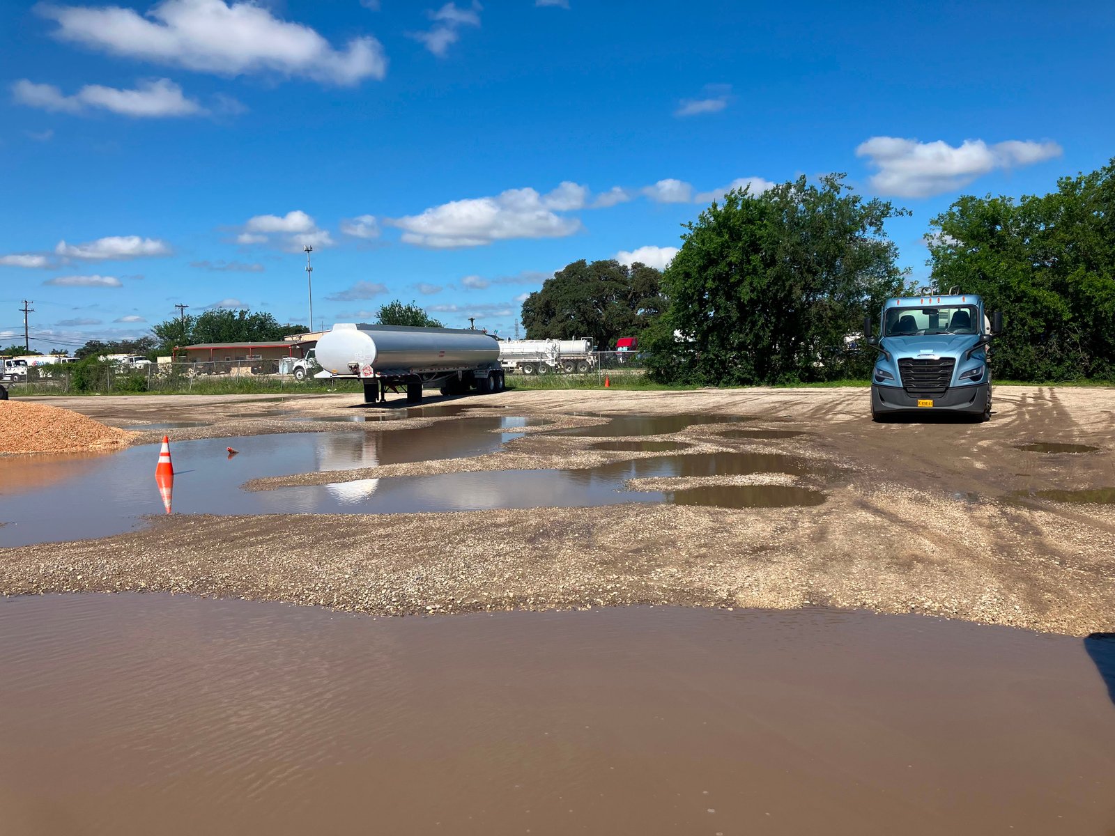 Commercial parking lot showing drainage and standing water challenges